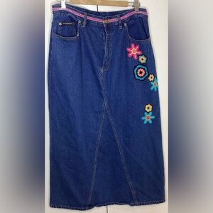 Long Jean skirt with floral embroidery  and back split.  Lg